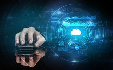Hand using wireless mouse with cloud technology concept and dark background