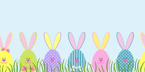 Seamless border with Easter bunnies in the green grass. Decorative Easter bunnies. Vector illustration