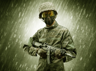 Armed soldier standing in rainy weather
