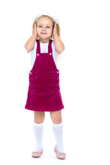 Little girl posing in studio on a white background.