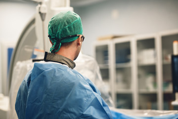 Doctor doing an endovascular minimally invasive cardiology transcatheter angioplasty stent treatment for coronary artery.