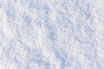 Texture of the white fluffy snow for background
