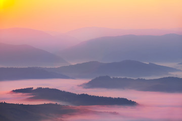 Naklejka na ściany i meble beautiful quiet mountain in the blue mist at the dawn