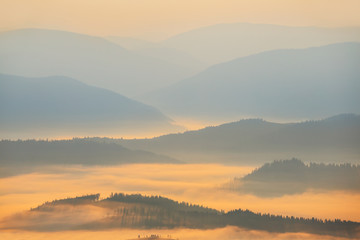 beautiful mountain landscape, mountain silhouette in the blue mist at the early morning