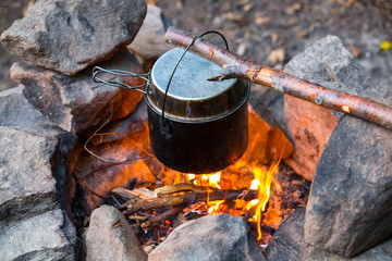 touristic cauldron heat on a camp fire