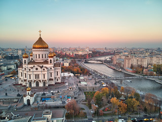 Fototapeta premium Sunset view of Moscow Cathedral of Christ the Savior in Moscow, Russia. Moscow river and patriarchal bridge. Aerial view
