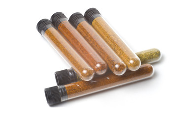 cones bottles with different types of chili peppers. ground pepper, seasoning