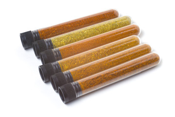 cones bottles with different types of chili peppers. ground pepper, seasoning