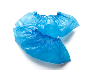 Two blue medical Shoe covers for feet isolated on white background. Hygiene and cleanliness in health facilities