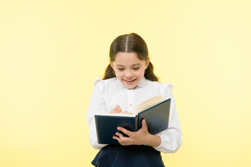 Back to school. Childhood happiness. happy little girl in school uniform. small girl child. private teaching. Smart school girl. childrens day. Education online. She has got the book she needs