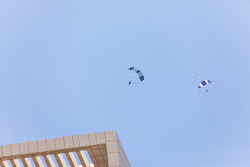 Fototapeta na wymiar DUBAI, UNITED ARAB EMIRATES Paragliders over Dubai marina in Dubai, United Arab Emirates