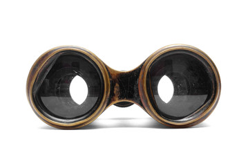 Vintage binoculars isolated on the white background.