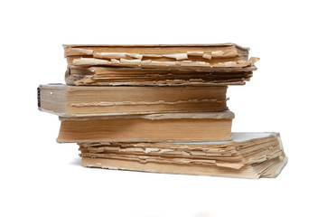 Stack of aged books isolated on a white background.