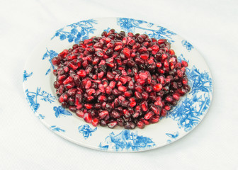 pomegranate on an old plate