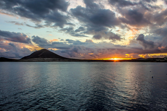 Cloudy Sunset Above Mountain