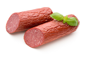 Salami smoked sausage, basil leaves on white background cutout.