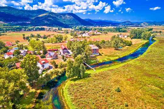 Colorful Gacka valley field and river aerial summer view
