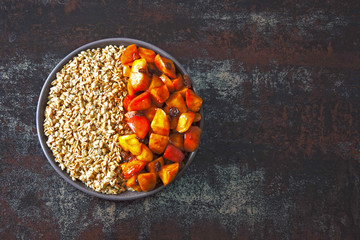 Oatmeal with apples and cinnamon. Breakfast bowl with oatmeal and apples.