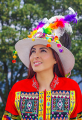 Portrait of beautiful young woman wearing typical folklore clothes used for festivity and dance in...