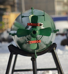 Green torpedo tail on a stand