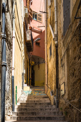 Picturesque staircase in a narrow alley of Sciacca old town, Sicily, Italy