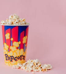 Popcorn on a pastel pink background and a place for text. Flat lay. Copyspace. Cinema Concept. Background