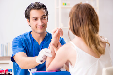 Young patient during blood test sampling procedure  