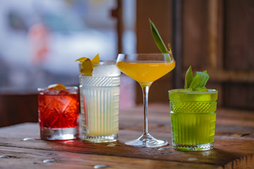 Image of colorfull coctails in the bar, mixology concept