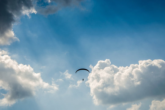 Paragliding in the sky,Paraglider taking off in front of spectacular mountain scenery