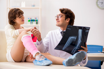 Young woman visiting doctor traumatologist 
