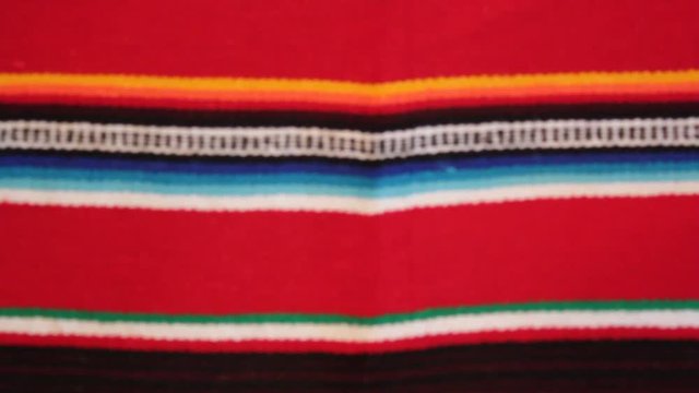 Mexican poncho blanket serape Mexico panning serape background with copy space - stock travel footage 