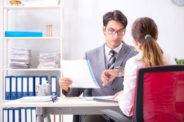 Man and woman discussing in office
