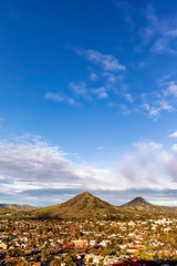 Sunny Day on the City and Mountains