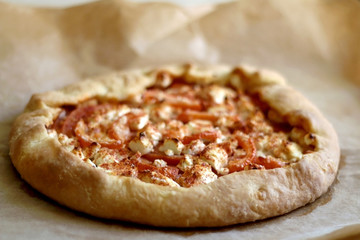 Tomato and feta cheese, seasoned with smoked pepper. Selective focus.