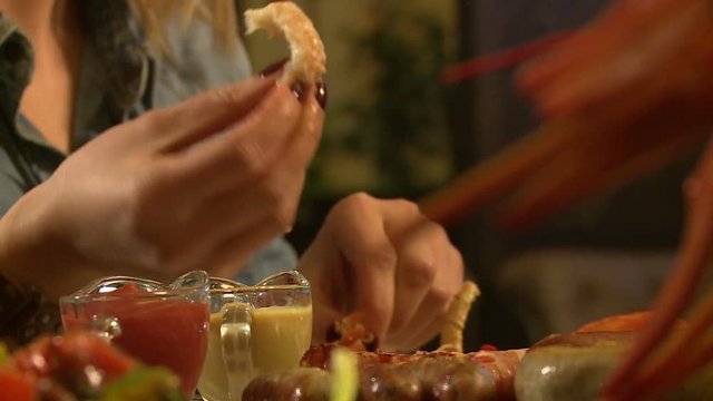 In the restaurant, the girl eats cancer, Crayfish