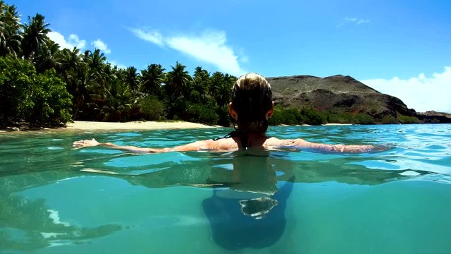 Tahuata Marquesas young female on deserted ocean beach