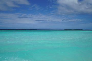 Amazing turquoise water view along a beach in the Maldives