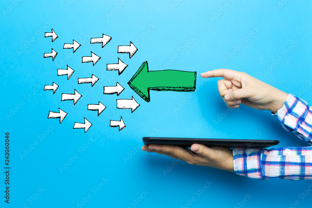 Poster arrow facing in a opposite direction with a tablet computer on a blue background