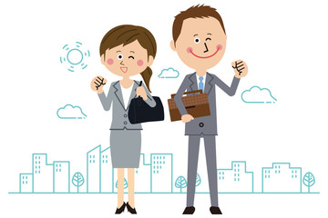 ポップなスーツの男女がガッツポーズ　全身　オフィス街