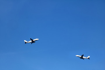 Fototapeta premium Airplane in the sky with white clouds and blue sky at samui island