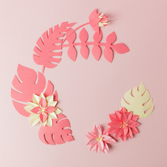 Exotic tropical multicolored leaf paper composition, creative application handcraft on a pink frame background with copy space. Greeting card. Flat lay, live coral concept