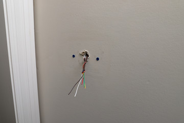 Wire for thermostat for air conditioning coming out of wall