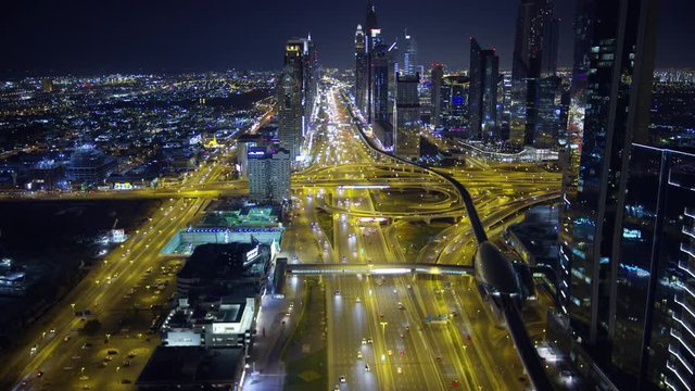 Aerial illuminated night view Dubai junction intersection UAE