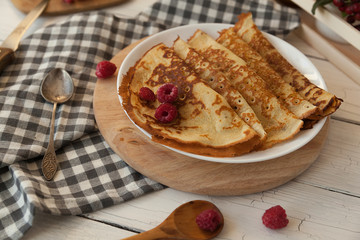 Pancakes Thin homemade pancakes with berries, traditional Russian cuisine. Homemade pancakes with berries