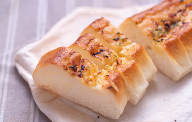Garlic bread on white napkin
