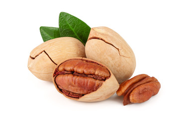 pecan nut with green leaves isolated on white background