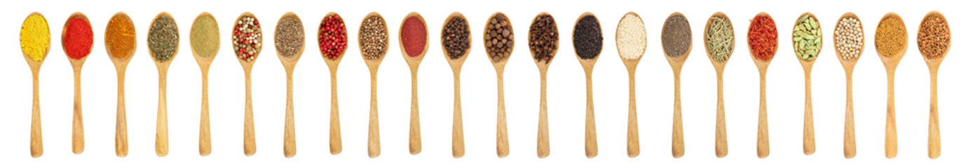 mix of spices in wooden spoon isolated on a white background. Top view. Flat lay. Set or collection