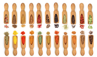 mix of spices in wooden scoop isolated on a white background. Top view. Flat lay. Set or collection