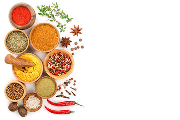 mix of spices in wooden bowl isolated on a white background with copy space for your text. Top view. Flat lay. Set or collection