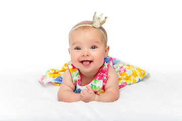 happy beautiful baby girl with crown on head